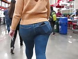 Latina fat ass and hips in tight jeans and wedge heel boots 